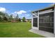 Screened porch overlooking backyard with lush lawn at 126 Harbor Trace Ln, Summerville, SC 29486