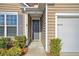 Gray front door with sidelights and landscaping at 126 Harbor Trace Ln, Summerville, SC 29486
