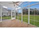 Bright sunroom with wood tile flooring and ample windows offering backyard views at 126 Harbor Trace Ln, Summerville, SC 29486