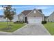 One story home with attached garage and manicured lawn at 126 Harbor Trace Ln, Summerville, SC 29486
