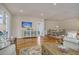 Open living room with hardwood floors, neutral colors, and access to dining area at 126 Harbor Trace Ln, Summerville, SC 29486