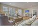 Bright living room with hardwood floors, comfy seating, and access to a deck at 126 Harbor Trace Ln, Summerville, SC 29486