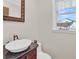 Elegant bathroom with dark vanity and vessel sink at 203 Hickory Nut Drive, Harleyville, SC 29448