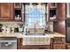 Kitchen sink and granite countertop with window view at 203 Hickory Nut Drive, Harleyville, SC 29448