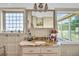 Bathroom features granite vanity, large mirror, and views to backyard at 203 Hickory Nut Drive, Harleyville, SC 29448
