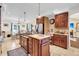 Island kitchen with granite countertops and stainless steel appliances at 203 Hickory Nut Drive, Harleyville, SC 29448