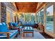 Sunroom with blue and white striped furniture and wood ceiling at 203 Hickory Nut Drive, Harleyville, SC 29448