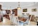 Eat-in kitchen with dark wood cabinetry, tile floors, and a center island at 203 Hickory Nut Drive, Harleyville, SC 29448