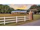 Brick ranch home with metal roof, expansive lawn, and gated entrance at 203 Hickory Nut Drive, Harleyville, SC 29448
