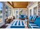 Bright sunroom featuring a wooden ceiling and comfortable seating at 203 Hickory Nut Drive, Harleyville, SC 29448