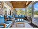 Relaxing sunroom with blue and white striped furniture at 203 Hickory Nut Drive, Harleyville, SC 29448