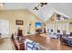 Open living area with hardwood floors, vaulted ceiling, and a cozy seating area at 203 Hickory Nut Drive, Harleyville, SC 29448