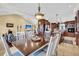 Spacious kitchen with island, granite countertops, and stainless steel appliances at 203 Hickory Nut Drive, Harleyville, SC 29448