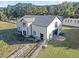 Large white barn with metal roof and multiple stalls at 203 Hickory Nut Drive, Harleyville, SC 29448