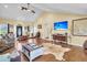 Open concept living room with hardwood floors, vaulted ceilings, and large windows at 203 Hickory Nut Drive, Harleyville, SC 29448