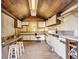 Rustic kitchen with wood ceilings and white cabinets at 203 Hickory Nut Drive, Harleyville, SC 29448