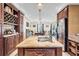 Kitchen island with granite countertop and built-in wine rack at 203 Hickory Nut Drive, Harleyville, SC 29448