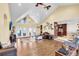 Open living room with hardwood floors, vaulted ceilings and access to the back patio at 203 Hickory Nut Drive, Harleyville, SC 29448