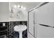 Clean bathroom with pedestal sink, shower, and black and white tile at 203 Hickory Nut Drive, Harleyville, SC 29448