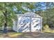Double-door garage with weathered white paint at 203 Hickory Nut Drive, Harleyville, SC 29448