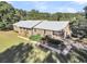 Brick ranch house with a metal roof and large backyard at 203 Hickory Nut Drive, Harleyville, SC 29448
