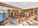 Finished basement with a pool table and built-in shelving at 203 Hickory Nut Drive, Harleyville, SC 29448