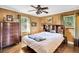 Bedroom with wood paneled walls and a wooden dresser at 203 Hickory Nut Drive, Harleyville, SC 29448