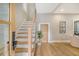 Modern staircase with cable railing and light hardwood at 176 Congress St, Charleston, SC 29403