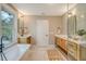 Stunning bathroom with double vanity, soaking tub, and walk-in shower at 176 Congress St, Charleston, SC 29403