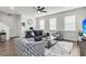 Living room with gray sofas, a coffee table, and ceiling fan at 681 Mclernon Trce, Johns Island, SC 29455