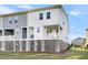 Townhouse exterior showing private backyard and ground level access at 681 Mclernon Trce, Johns Island, SC 29455
