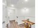 Bright hallway with wood-look floors and a unique wood console table at 681 Mclernon Trce, Johns Island, SC 29455