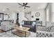 Spacious living room with gray sofas, a coffee table, and ceiling fan at 681 Mclernon Trce, Johns Island, SC 29455