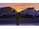 Beautiful sunset view of townhomes with spacious yards at 681 Mclernon Trce, Johns Island, SC 29455