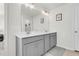 Modern bathroom with double vanity and gray cabinets at 681 Mclernon Trce, Johns Island, SC 29455