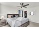 Spacious bedroom with a gray platform bed and ceiling fan at 681 Mclernon Trce, Johns Island, SC 29455