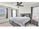 Bright bedroom with a gray platform bed and two windows at 681 Mclernon Trce, Johns Island, SC 29455