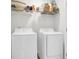 Bright laundry room with Samsung washer and dryer, and wire shelving for storage at 681 Mclernon Trce, Johns Island, SC 29455