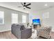 Living room with gray sofas, a coffee table, and ceiling fan at 681 Mclernon Trce, Johns Island, SC 29455