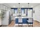 Modern kitchen with gray cabinets, stainless steel appliances, and a blue island at 681 Mclernon Trce, Johns Island, SC 29455