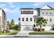 Three-story townhome with front yard landscaping and two-car garage at 681 Mclernon Trce, Johns Island, SC 29455