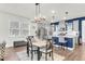 Modern kitchen with gray cabinets, stainless steel appliances, and a large island at 681 Mclernon Trce, Johns Island, SC 29455
