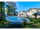 Large kidney shaped pool with diving board at 1647 Sulgrave Rd, Charleston, SC 29414