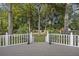 Deck overlooks backyard with wooden fence and lush trees at 205 Turtle Cove Rd, Summerville, SC 29485