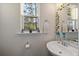 Clean and modern bathroom with pedestal sink and window at 139 Winding River Dr, Johns Island, SC 29455