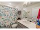 Clean bathroom with a shower/tub combo and gray vanity at 139 Winding River Dr, Johns Island, SC 29455