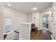 Upstairs hall with hardwood floors and access to bedrooms at 139 Winding River Dr, Johns Island, SC 29455