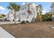 Three story townhome with attached garage and front yard at 139 Winding River Dr, Johns Island, SC 29455