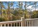 Deck with wooded views and white railings at 139 Winding River Dr, Johns Island, SC 29455