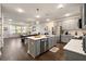Modern kitchen with grey cabinets, quartz countertops, and an island at 139 Winding River Dr, Johns Island, SC 29455